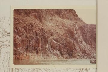 Across the river below the mouth of Separation Canyon showing the area where Powell got rimmed 1869, Aug. and would have dropped into the river had he loosed his hand-hold. The fiction is obvious