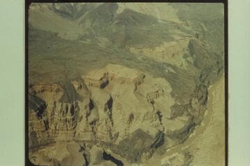 Lava flows from the Uinkaret Range. The bend of the river at lower center is approximately Mile 183