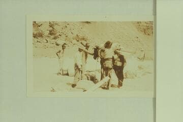 New oars arriving by pack train at Hance Rapid. LaRue is at left