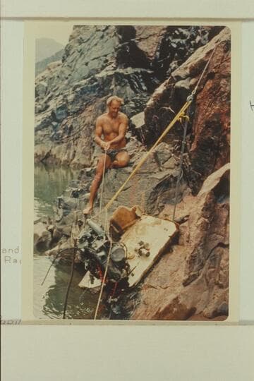 A lift on the engine during salvage of inboard-outboard (Homer Morgan). Head of Gneiss Canyon Rapid