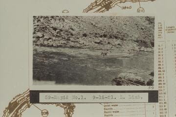 Ellsworth Kolb in USGS skiff in the Brown Betty Rapid, No. 1. The Brown Betty Rapid heads at Mile 212.3 and drops 4 ft. in .15 miles