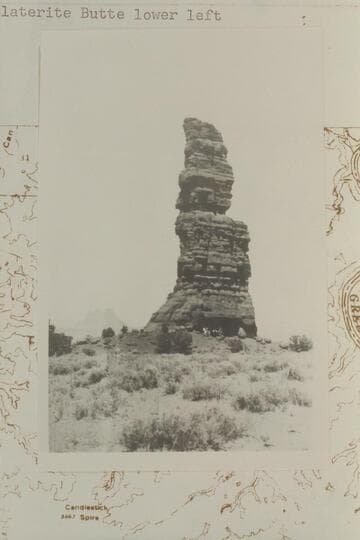 The Totem Pole. Triangulation Station M. Moencopie outlier on Coconino Sandstone. Elevation of top: 5788 ft. Green River Desert. Elaterite Butte lower left