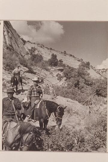 Down the trail into Navajo Canyon. Bahe at left with Bill Belknap behind him and Jorgen Visbak beyond