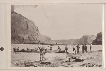 The LaRue party in Glen Canyon in Sept. 1922. Tom Wimmer was head boatman, Lewis R. Freeman stands left center foreground