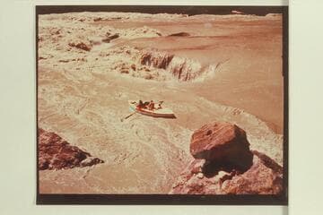 The "Susie R" runs Boulder Narrows. Preliminary Lees Ferry gauge: 122,000 cfs. Print sent by Reilly