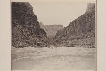 Nevills carrying Margaret Garthwaite Marston as passenger through North Canyon Rapid. Kent Frost runs close behind. Mile 20 1/2 in Marble Canyon. Lees Ferry gauge: 36,100 cfs