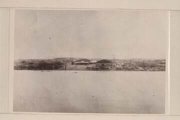Ehrenberg from mid-river.  Ehrenberg has been cut out by bulldozers.  Saloon is store at Ehrenberg; it was old government building formerly used to house soldiers [Mrs. Fred Kuehn]