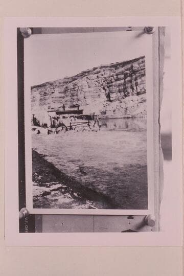Rear view of Moab Garage Company scow showing paddle wheel in action. The wheel was 8 ft. in diameter