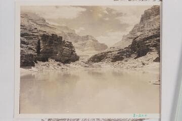 Downriver from the lunch stop of 1934, July 29, below Fossil Rapid about Mile 125.6. The granite of the Middle Granite Gorge could be seen downriver. In 1937, Sharp placed the appearance of the Archean at 200 yds. above 127 Mile Rapid