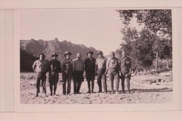 USGS crew at McPherson Ranch above Greenriver, Utah. Clogston, Reeside, Loper, Stoner, Lint, Trimble, Woolley, Blake. McPherson Ranch. Note that four of the crew are wearing the dangerous choke-bored breeches