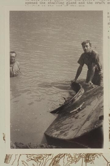 Duncan Harold McDermid at right. Frank Barnes at left. Lees Ferry. The sunken launch "Canopy." From negative in Waller collection