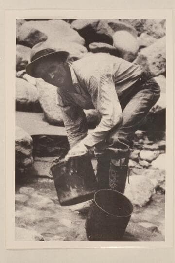 Parley Galloway washed the pots in Kwagunt Creek. Note the high laced boots