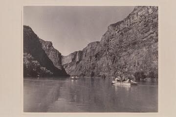 Near the head of Lodore Canyon. Nevills is the oarsman at the left and Kent Frost is at the right