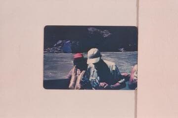 Evie and John Mull at end of motor run of 1952, May. John winds his camera with pliers