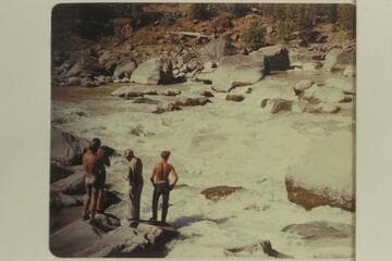 Bus Hatch's crew studying Hells Half Mile. Bus wears the cap and shirt. The others are Dale and Jack Collier, two boatmen, and Bill McLane, a passenger