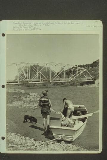 Stowing dunnage in punt at highway bridge below Dolores on the Dolores River. Becky and Pres Walker