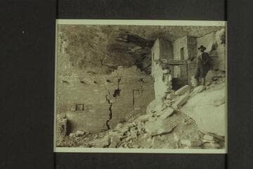 A glimpse into the interior of one of the houses. Note the cracked walls and cedar logs built in--used probably to support a walk or balcony
